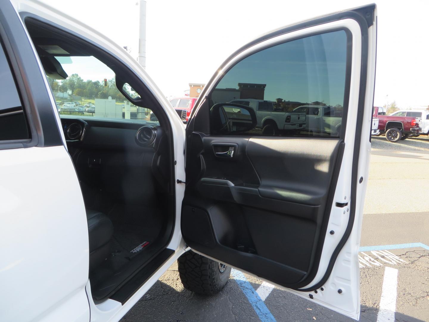 2019 White /black Toyota Tacoma TRD OFF-ROAD Double Cab (3TMAZ5CN4KM) with an 3.5L engine, automatic transmission, located at 2630 Grass Valley Highway, Auburn, CA, 95603, (530) 508-5100, 38.937893, -121.095482 - TRD Offroad 2WD sitting on Fox 2.5 remote reservoir DSC Coil-overs, Total Chaos upper control arms, Rigid Industries Dually side shooter leds, Fuel Rebel wheels, Nitto Ridge Grappler tires, and window tint. - Photo#40